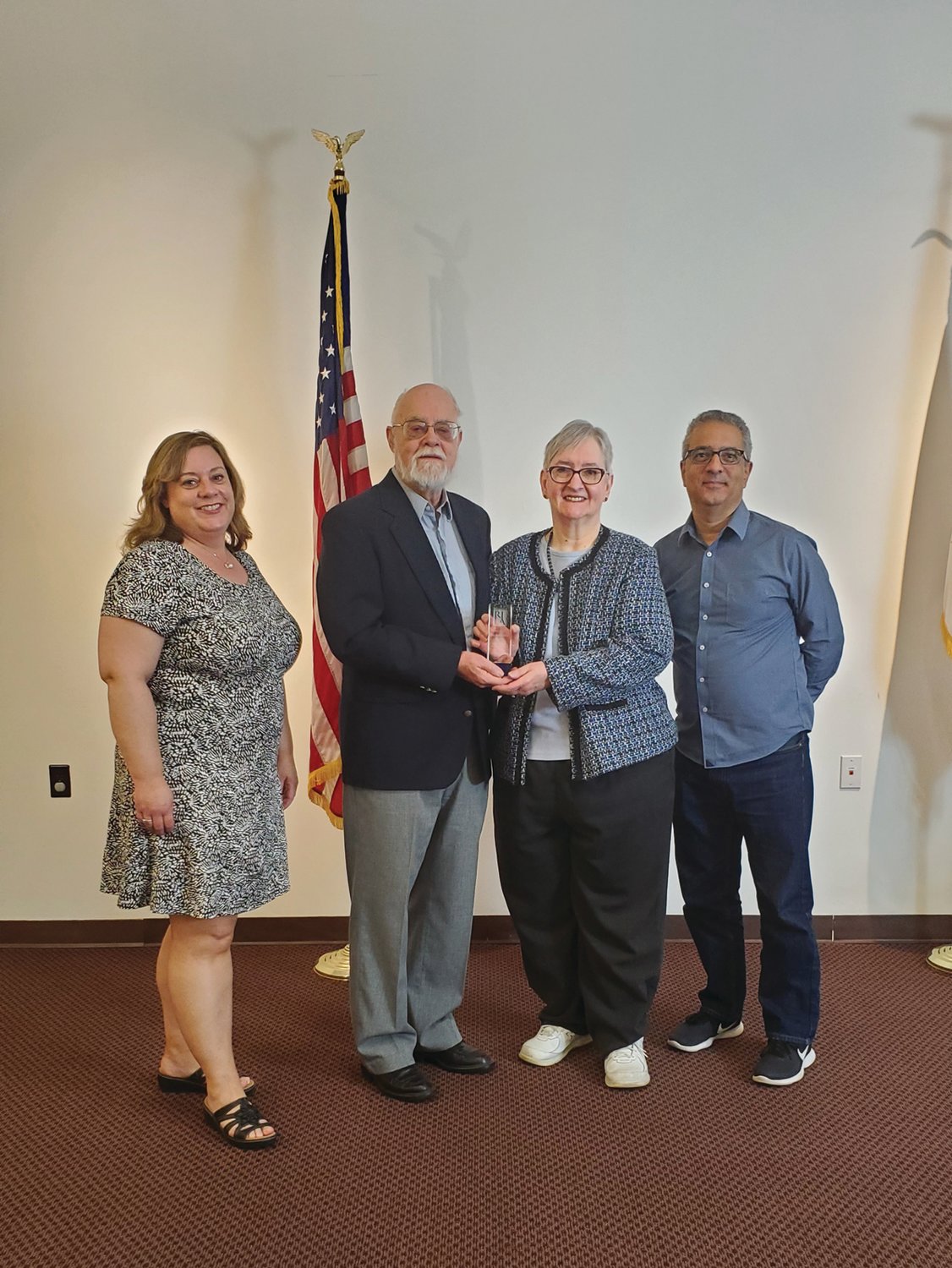 FRIENDS OF THE LIBRARY: Mary Ann and Walter Slocomb
received the Meritorious Friend of the Library Award for their contributions to the Cranston Public Library. They are joined by Julie Holden, outgoing president of the Rhode Island Library Association, and Ed Garcia, director of the Cranston library system.